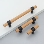 Set of wood drawer handles in different lengths on gray background.