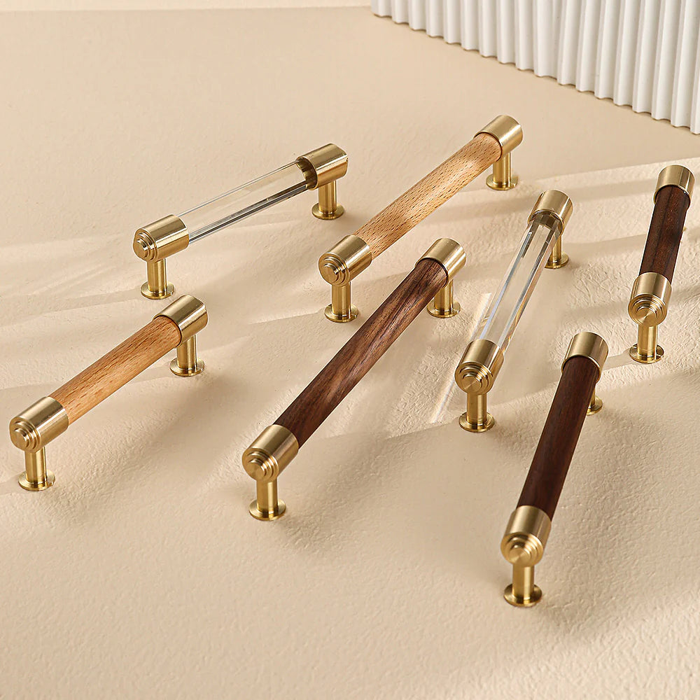 Assorted brass and crystal cabinet handles in wood and crystal combinations.