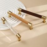 Brass and crystal cabinet handles featuring walnut, beech, and clear designs.