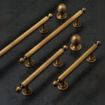 Set of bronze cabinet handles on a dark background